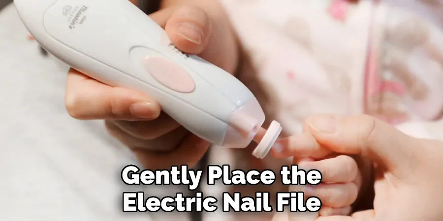 Gently Place the Electric Nail File