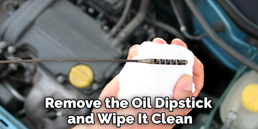 Remove the Oil Dipstick and Wipe It Clean
