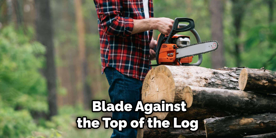  Blade Against the Top of the Log