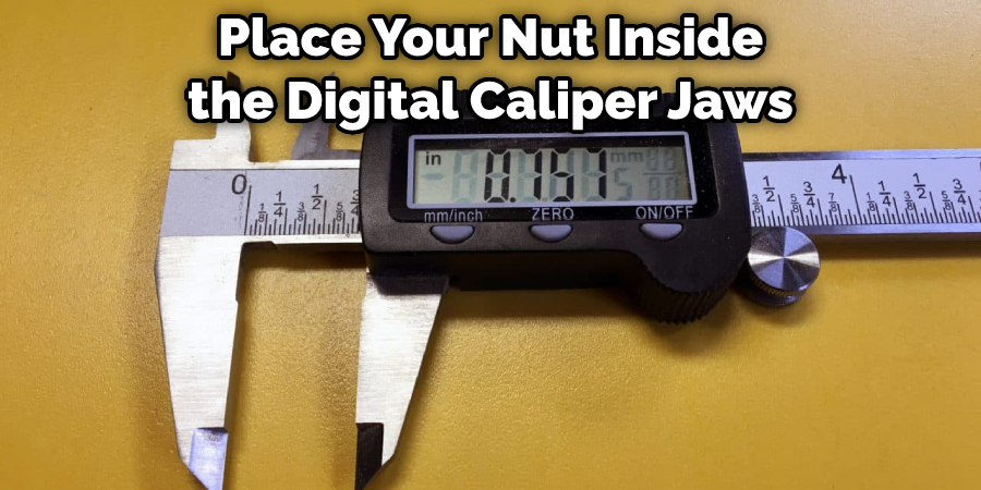 Place Your Nut Inside the Digital Caliper Jaws