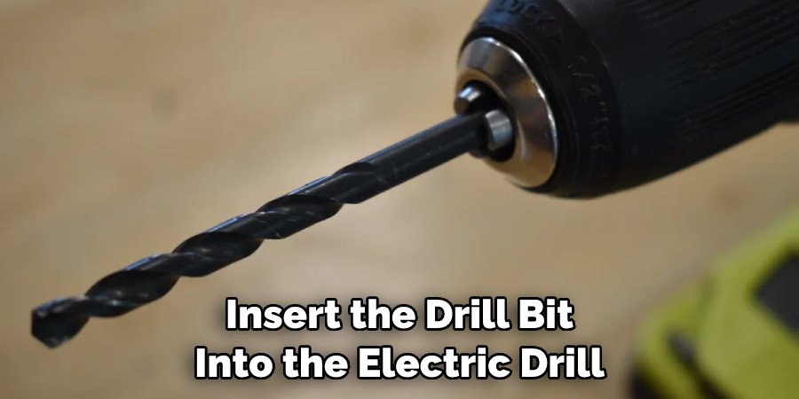 Insert the Drill Bit Into the Electric Drill
