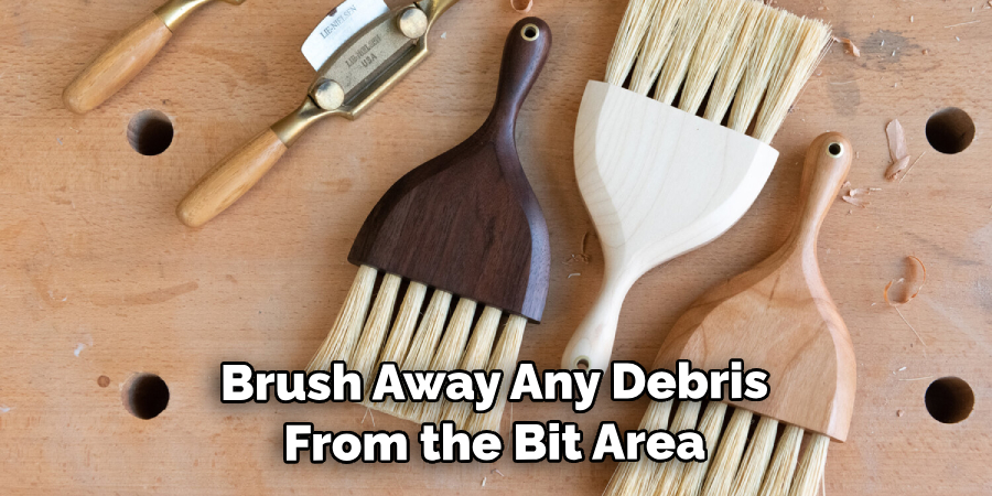 Brush Away Any Debris From the Bit Area